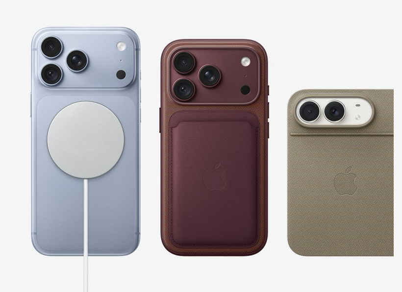 Three smartphones are shown from the back. The left phone is blue with a MagSafe charger attached, highlighting its circular design. The center phone is burgundy with a matching leather MagSafe wallet attached, featuring three rear cameras. The right phone is beige with two rear cameras, featuring a textured case. The Apple logo is visible on the two phones with attached accessories. Each phone showcases different color options and MagSafe-compatible accessories.