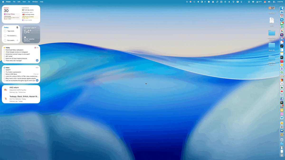 A computer desktop displaying a serene blue and beige abstract wallpaper. Widgets and notifications are present on the left side, showing tasks, weather, and emails. Various icons run along the right margin, likely representing applications and folders. The top menu bar includes standard items like Finder, File, and Edit. The image visually suggests a well-organized digital workspace.