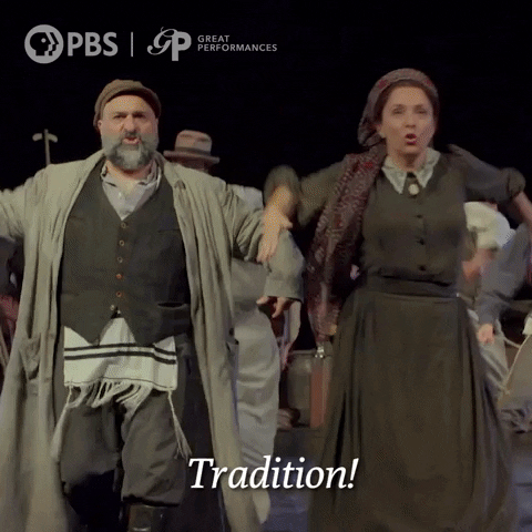 The cast of Fiddler on the Roof sings "Tradition!"