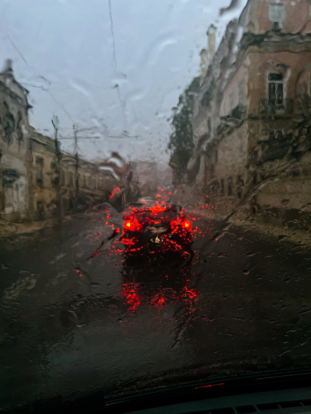 rainy street seen from the inside of a car