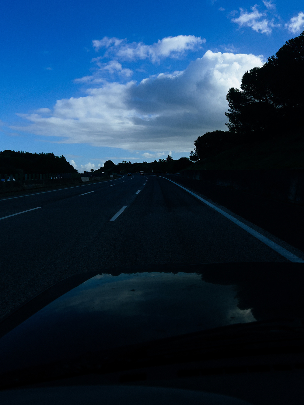 A cloud looms over the highway.