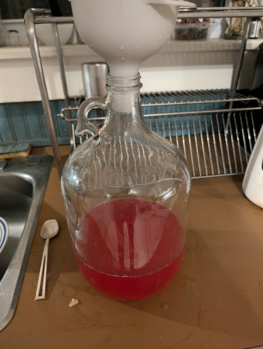 A big jug of elderberry liqueur, very magenta