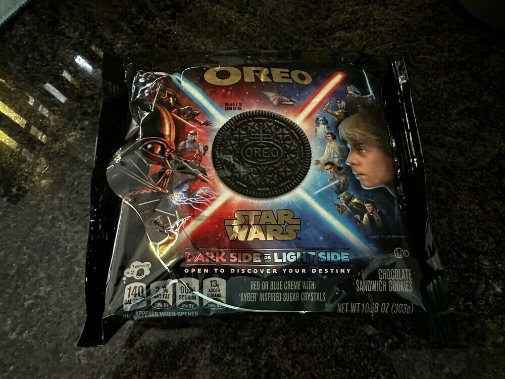 A pack of Star Wars-themed Oreo. The packaging notes that cookies may contain blue or red cream to determine if your destiny is with the light or dark side.