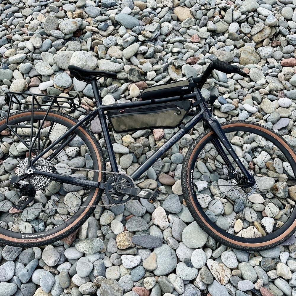 gravel bike on a stone beach