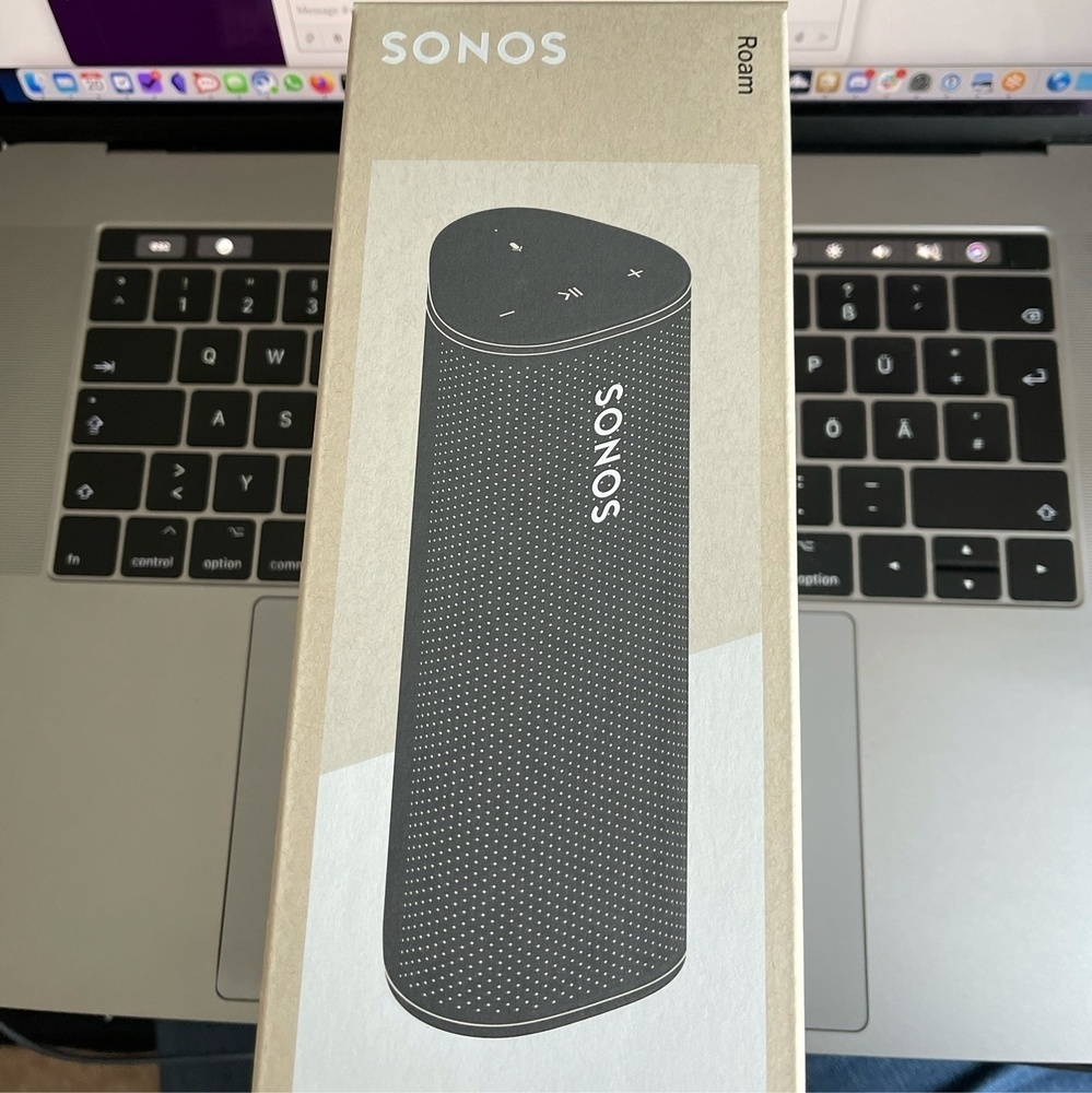 Sonos Roam in box, black image of product printed on the beige box. 
