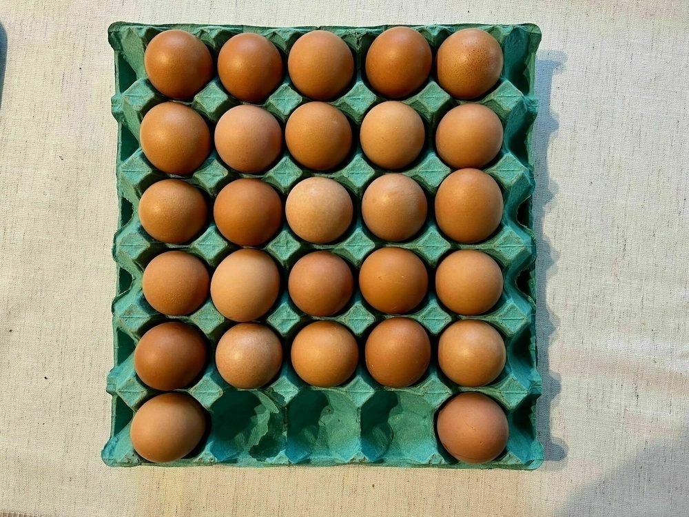27 eggs in a tray; 3 empty slots. 