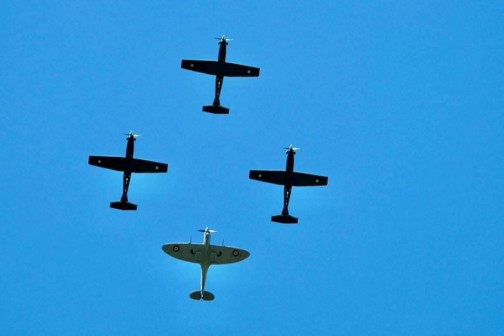 The tight formation of 4 planes directly overhead. 