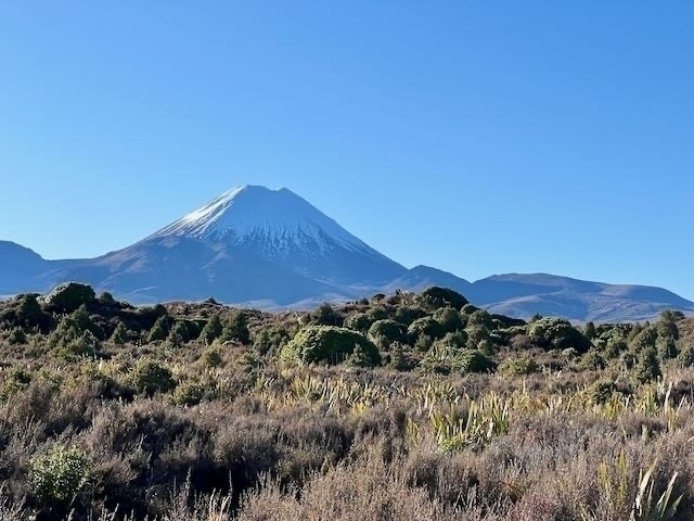 Ngauruhoe, a cone shaped mountain with a snow covered top. 