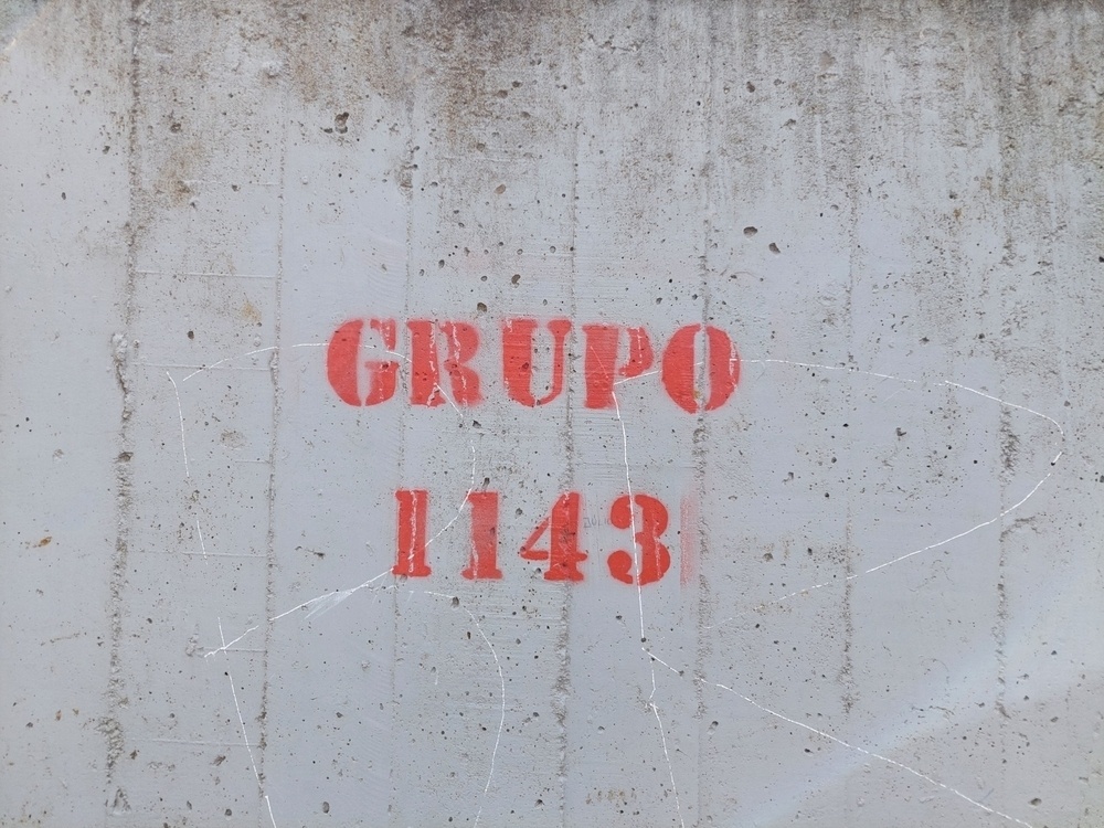 Inscrição com o seguinte: Grupo 1143. 
