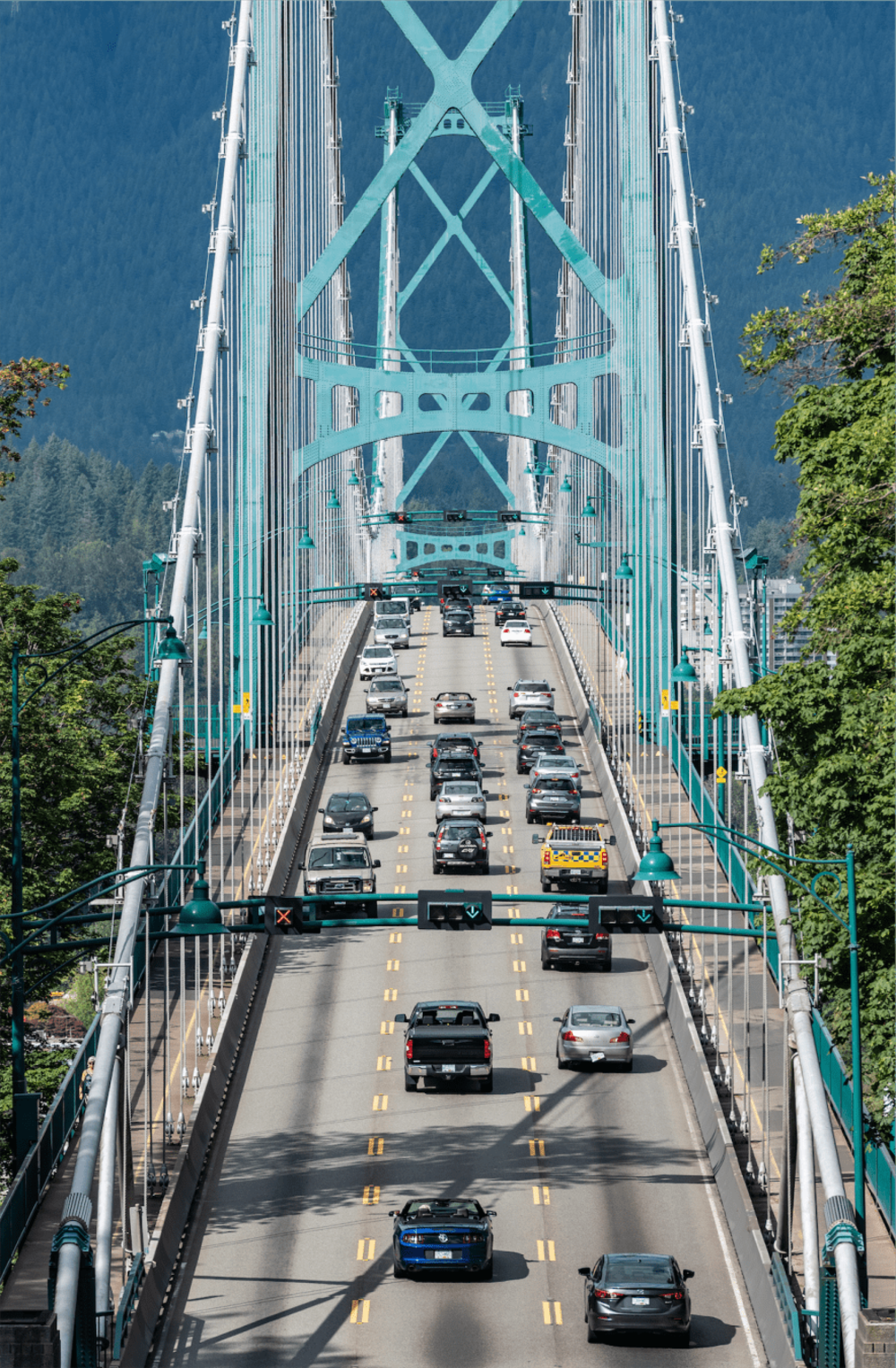 Many cars cross a bridge.