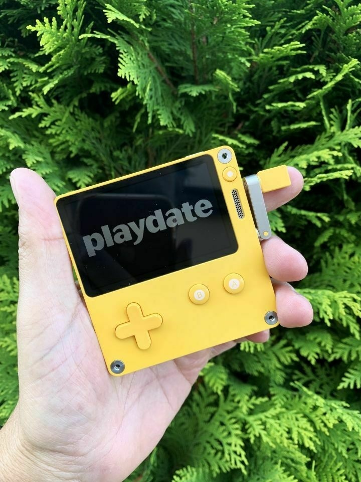 I hold this little yellow console in the palm of my hand.