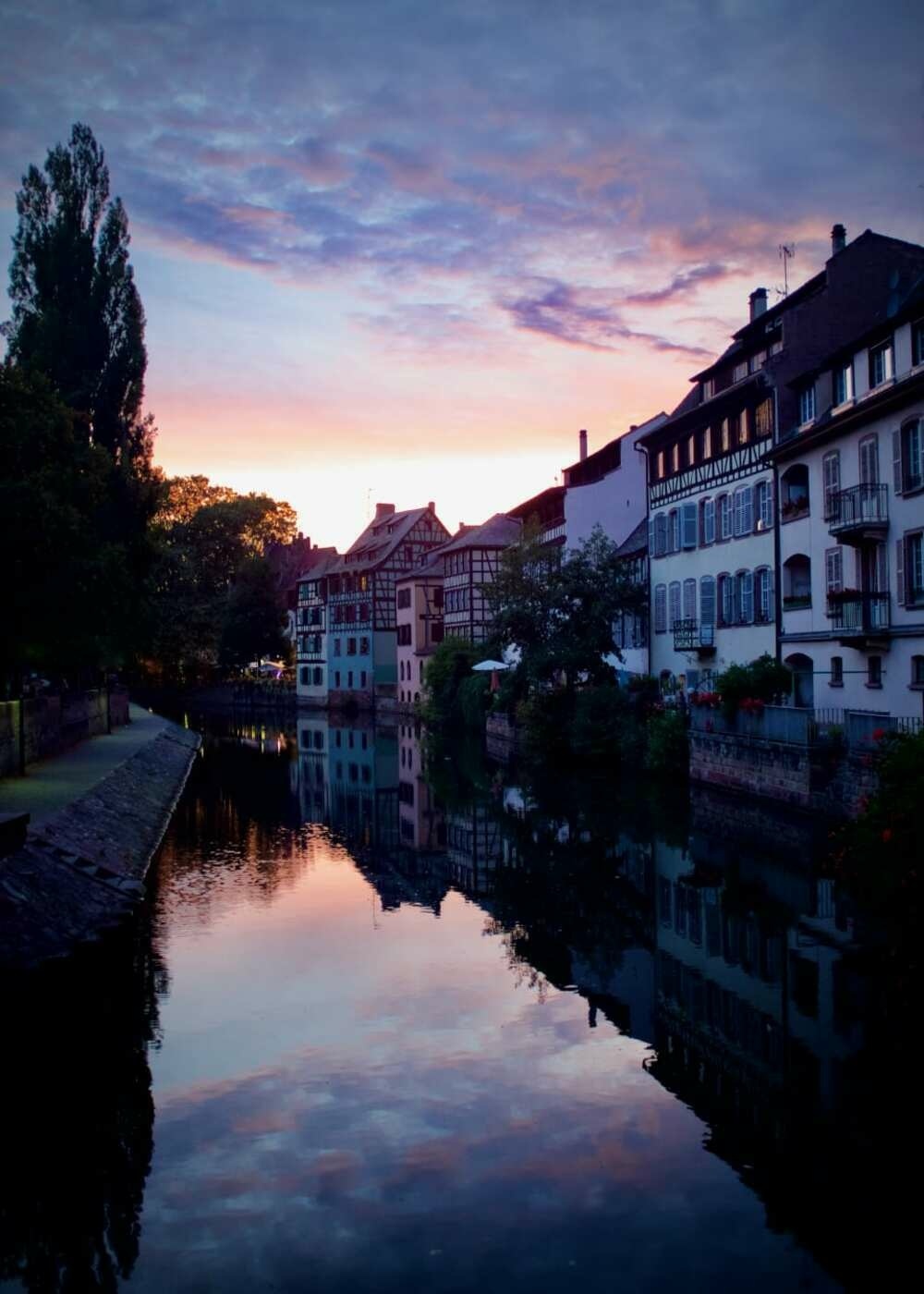 Sun setting over the river aside the La Petite France district of Strasbourg.