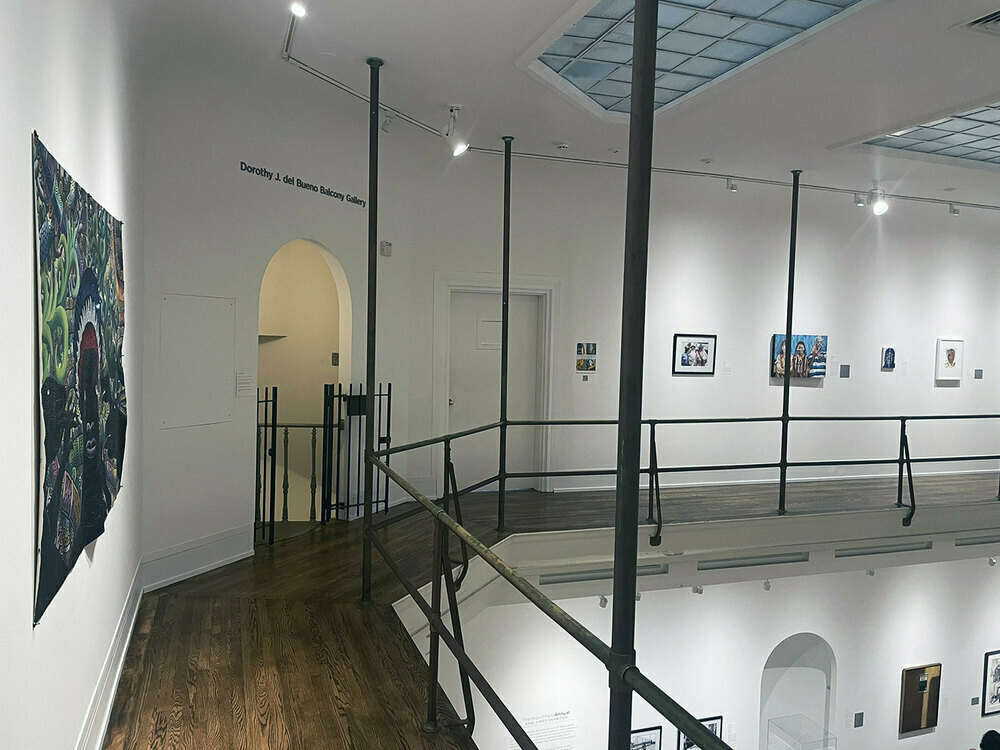 View of paintings from balcony in upper gallery