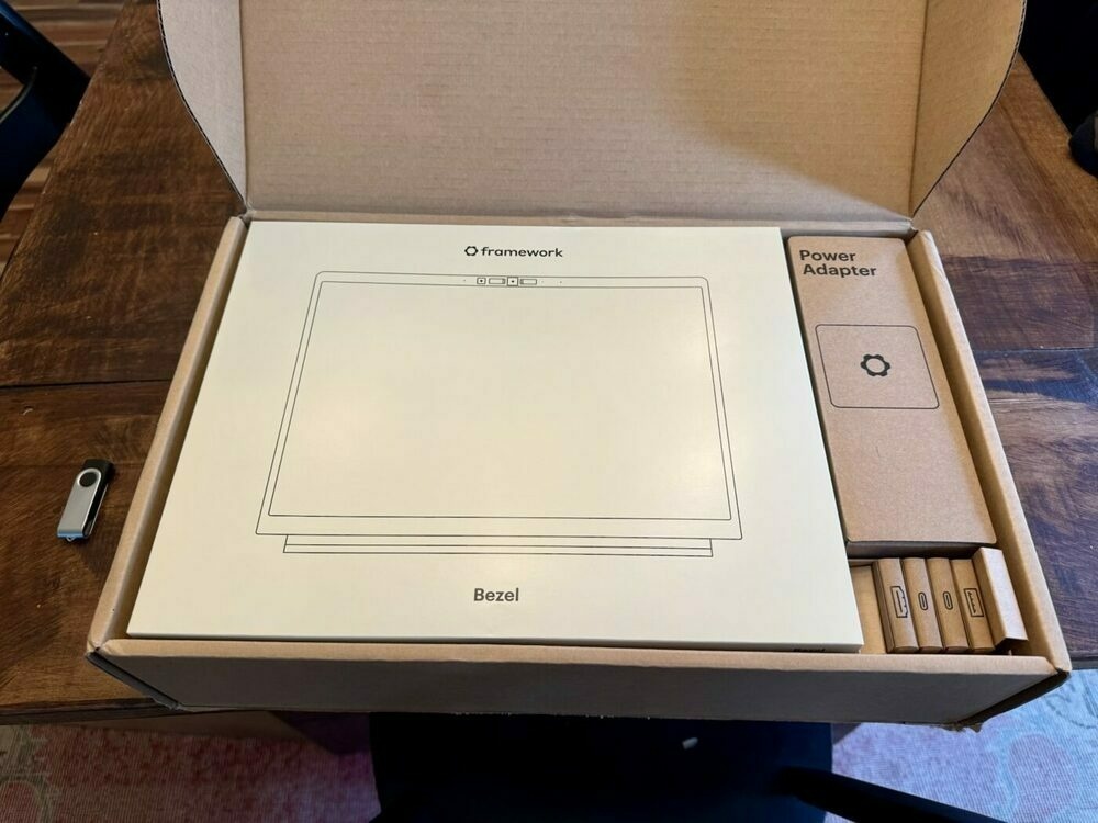 Partially opened Framework laptop box