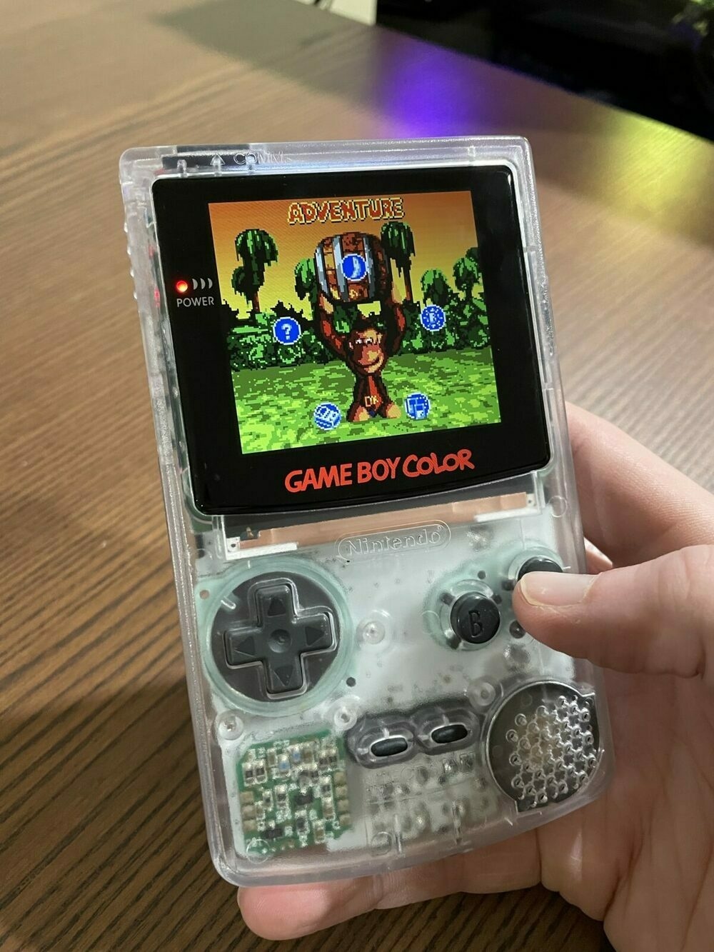 GameBoy Color with clear case playing Donkey Kong
