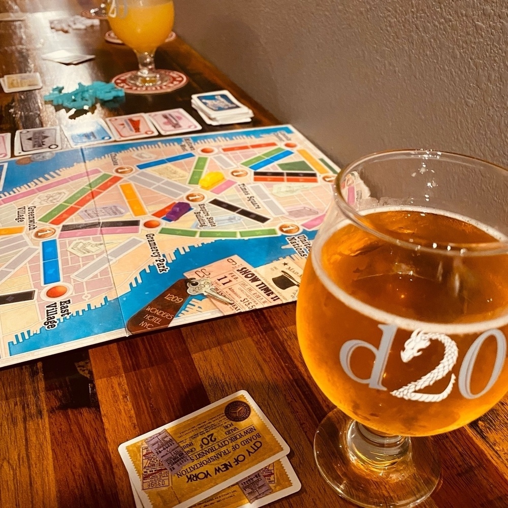 Photo of glass of beer and board game