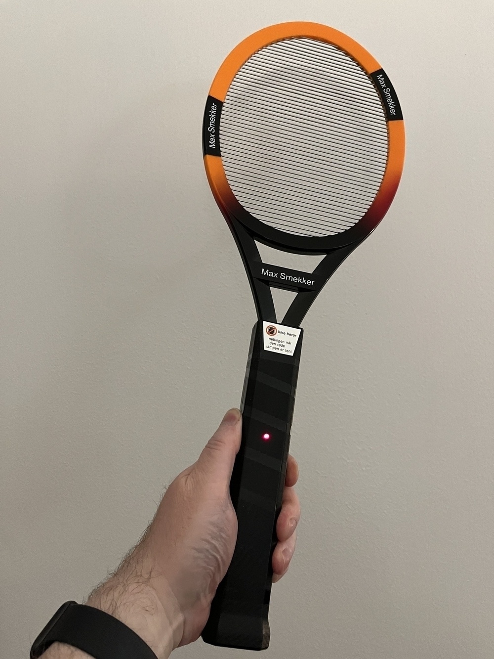 Racket shaped fly zapper.