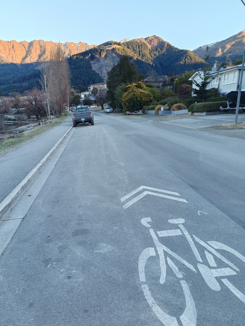Cyclist symbol and forward arrow painted on road
